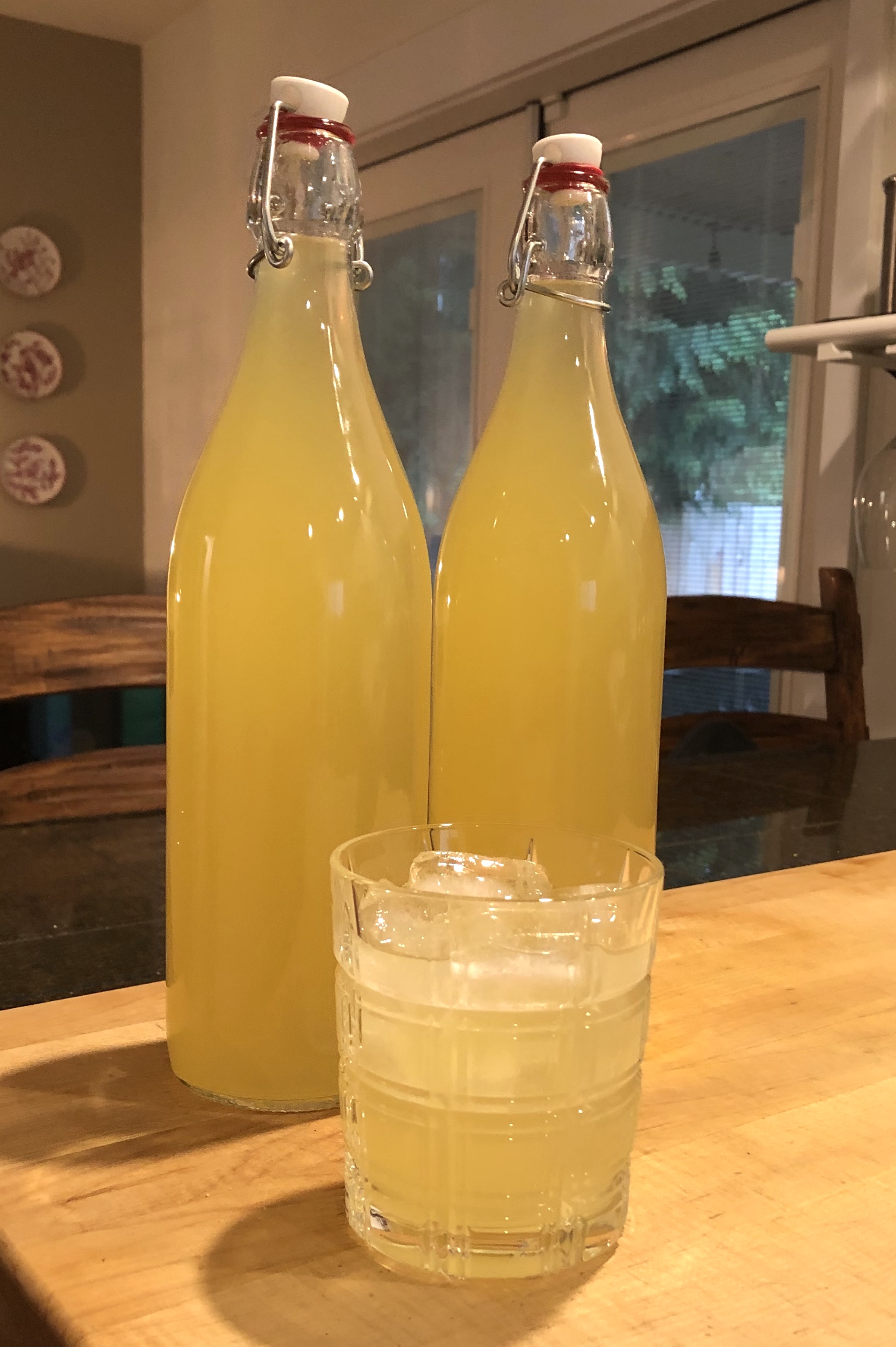 lemon drink in bottles and glass